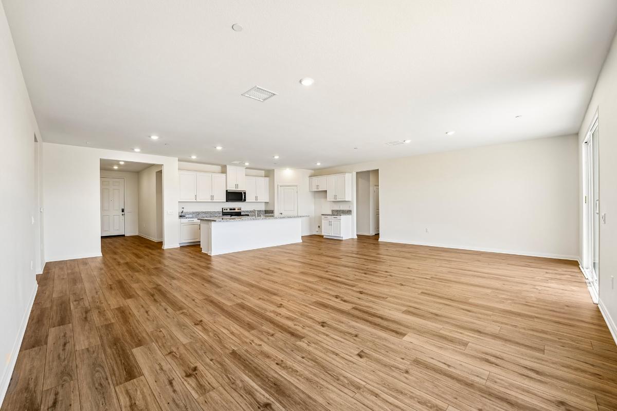 Representative builder view of the large shared kitchen and island